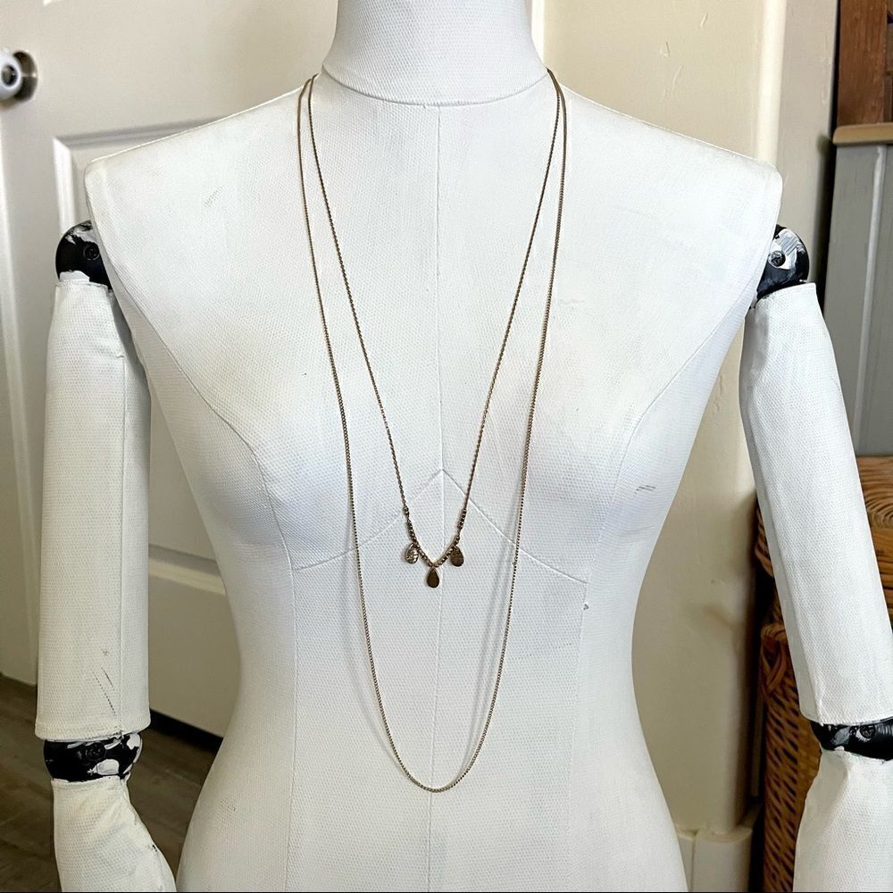 Gold colored two chain necklace